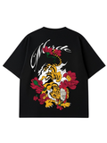 Black t-shirt with a colorful tiger and floral design on the back against a white background